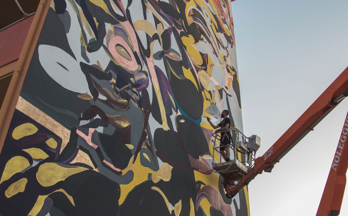 Giorgio Bartocci at work on a mural wall 